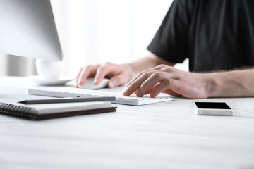 Businessman working on computer indoors