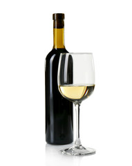 Glass of white wine with bottle on white background