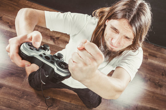 Unhappy male playing games