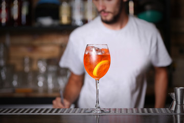 Barman preparing cocktail on bar counter
