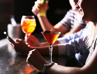 Friends with cocktails in bar