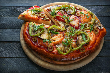Tasty sliced homemade pizza on table