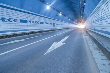 Fototapeta na wymiar Abstract speed motion in urban highway road tunnel, blurred moti
