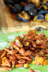 Plums sliced on a wooden board