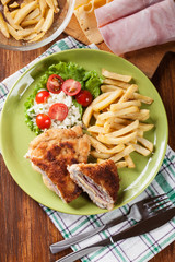Cutlet Cordon Bleu with pork loin served with French fries and s