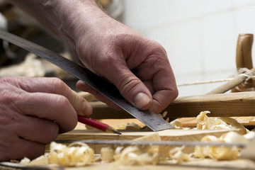 carpenter working,hammer,meter and screw-driver on construction