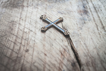 cross on wooden background