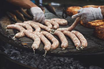 Street fast food, grilled sausages at bbq