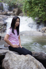 Thai woman with Mae Ya waterfall, Chiangmai Thailand