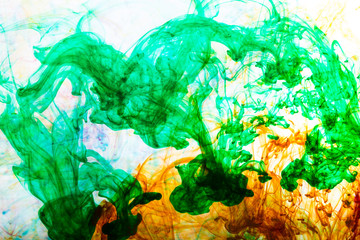 Acrylic colors and ink in water. Abstract background.