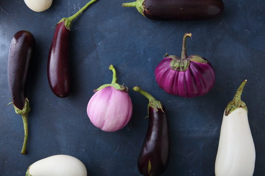 Fresh eggplants on slate