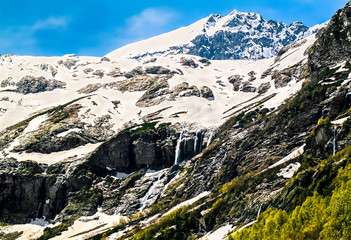 The majestic snow-covered peak of Sofia and its waterfalls