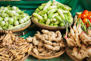 Baskets full of different tropical vegetables at market in Thailand
