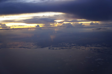 Fototapeta na wymiar sunset rich in dark space clouds,over the ocean