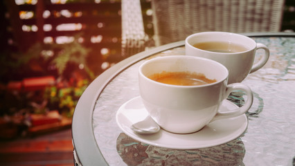 Coffee espresso and tea with nature background in garden.