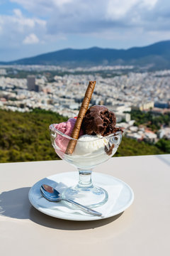 Sundae ice cream and view of town of Athens for background