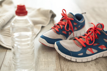 Sport shoes with water and towel