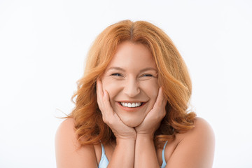 Cute mature woman laughing happily