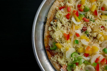 fresh pizza seafood on black wooden table. top view closeup image blank space