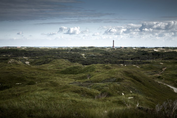 Fototapeta na wymiar Landscape with light house at North sea area, insel Norderney, Germany