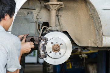 Changing brake disc with technician