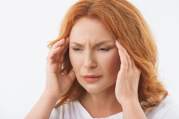 Obraz premium Desperate lady feels pain in head