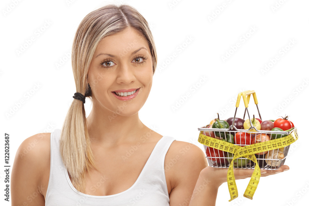 Poster Woman holding a small shopping basket