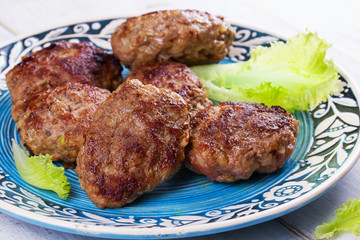 Beef and Pork Sausage Patties in Blue Plate