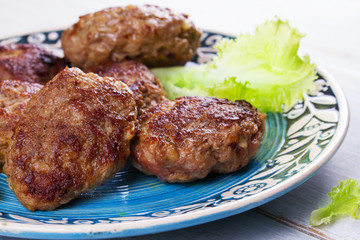 Beef and Pork Sausage Patties in Blue Plate