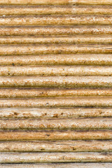 Roundish brown and yellow wooden logs, background