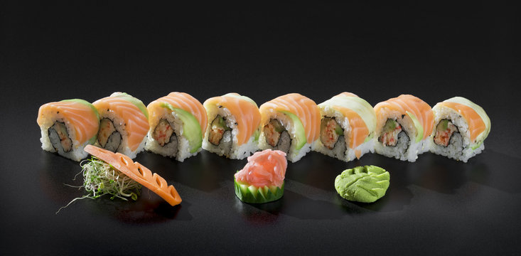 Japanese Sushi rolls. Uramaki maki sushi with salmon, fresh seaw