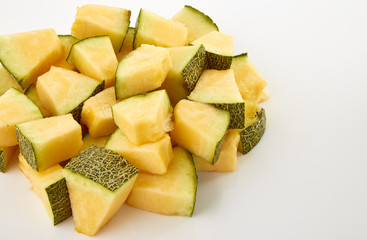Hamigua Melon cut into slices, Hami Melon, Hami Cantaloupe isolated on white background.