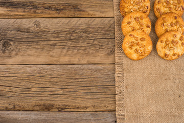 Cookies with peanut on old wooden table.