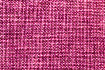 Purple textile background closeup. Structure of the fabric macro