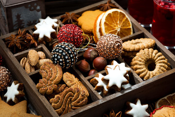 wooden box with Christmas sweets and spices