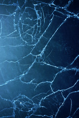 Cracked wooden wall with blue paint, abstract background