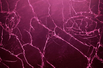 Cracked wooden wall with purple paint, abstract background