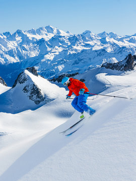 Skier skiing downhill Valle Blanche in french Alps in fresh powd