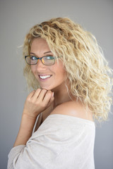 Portrait of attractive blond woman with eyeglasses, isolated