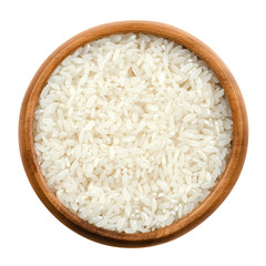 Sushi rice in a wooden bowl on white background. White short-grain Japanese rice, the seeds of the grass Oryza sativa, also known as Asian rice. Cereal grain and staple food. Isolated macro photo.