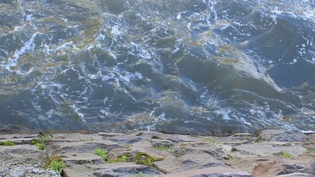 HDvideo with rocks and waves of water, closeup