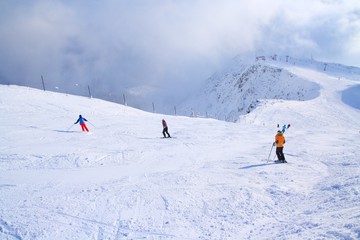 Fototapeta na wymiar Skiers on ski slope