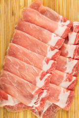 Close up shot on thinly sliced pork