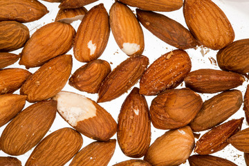 Texture of almonds ioslated on white background