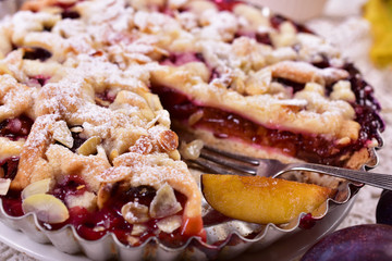 homemade plum tart with crumble