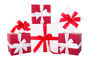 Birthday or Christmas concept - red and white gift boxes isolate