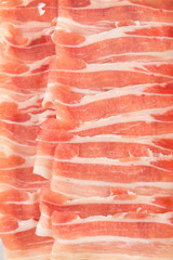 Close up shot on thinly sliced pork