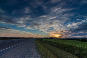 Fototapeta na wymiar the birth of a new day/ dawn, road, field, Krasnodar region, Russia