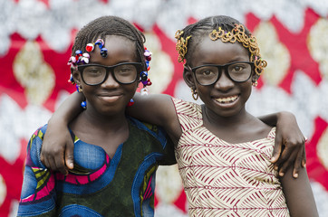 Two Beautiful African Schoolgirls Embracing Life with Happiness