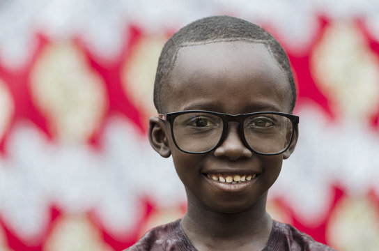 Little African School Nerd Child Boy Smiling at the Camera proudly (Black Portrait)